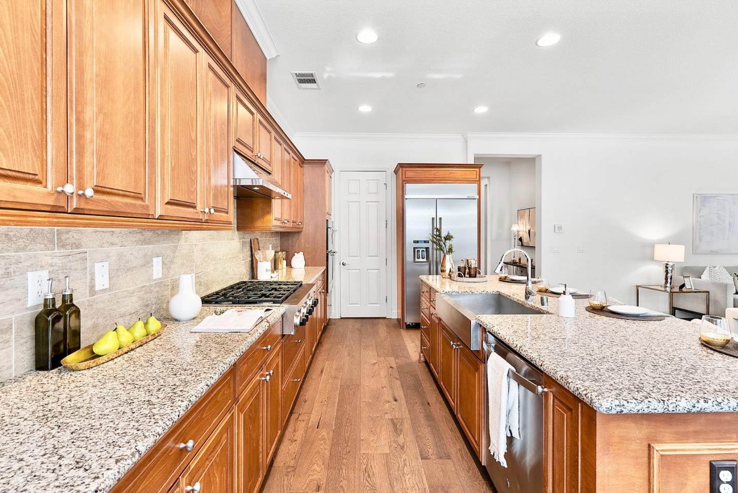532 Hyacinthus Court San Ramon, CA 94582 - Photo 7 of 31 a large kitchen with granite countertop a sink and dishwasher a stove top oven with wooden floor