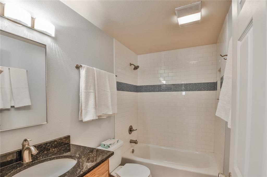 115 Reiling Road Breckenridge, CO 80424 - Photo 13 of 35 a bathroom with a granite countertop sink a toilet and shower