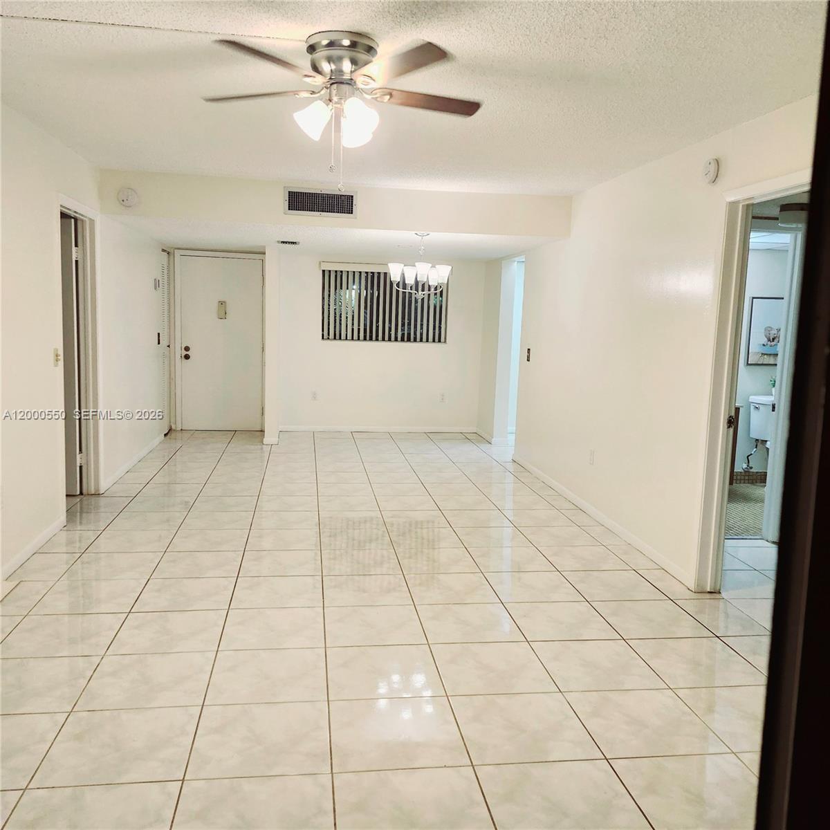 8415 Southwest 107th Avenue, Unit 238W Miami, FL 33173 - Photo 13 of 30 a view of an empty room with a window