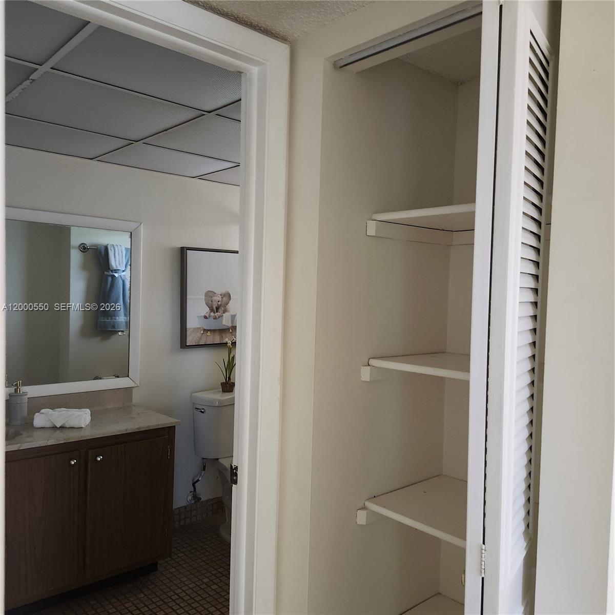 8415 Southwest 107th Avenue, Unit 238W Miami, FL 33173 - Photo 8 of 30 a bathroom with a sink a toilet and shower