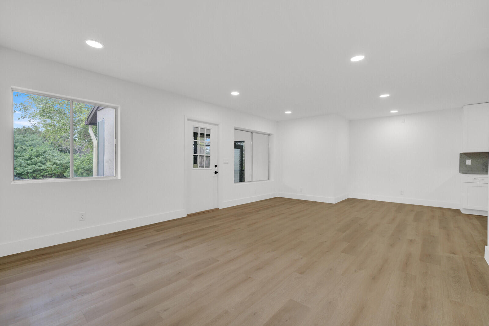 330 Pine Ridge Circle, Unit B2 Greenacres, FL 33463 - Photo 11 of 22 a view of an empty room with wooden floor and a window