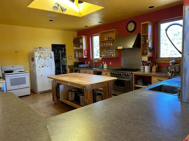 a kitchen with sink cabinets and stainless steel appliances
