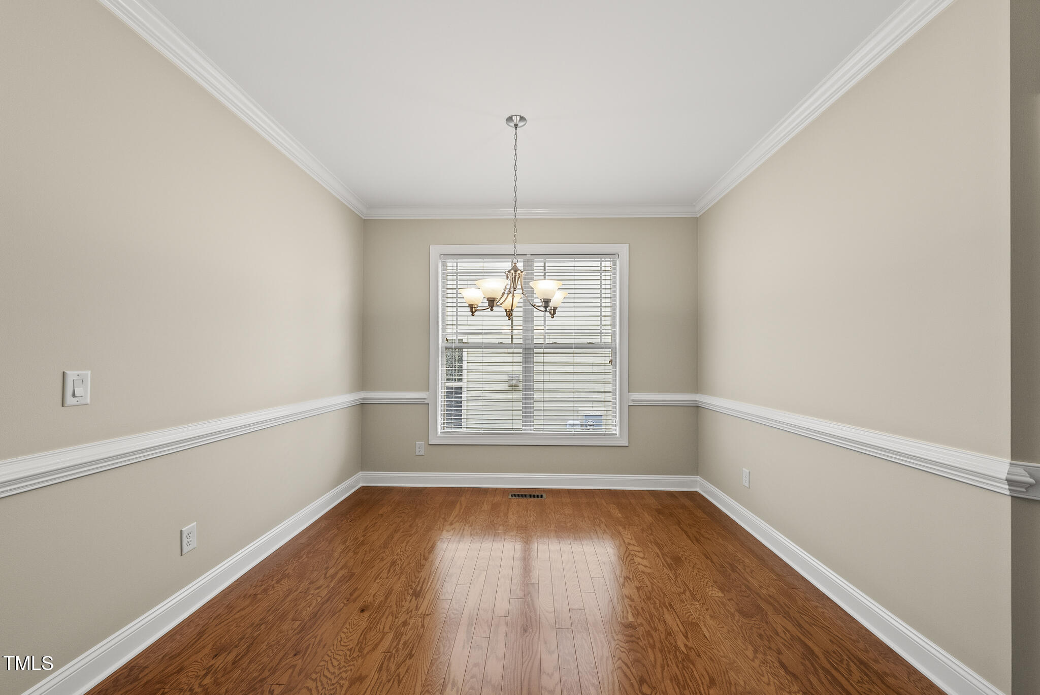 5120 Audreystone Drive Cary, NC 27518 - Photo 22 of 65 an empty room with wooden floor and windows