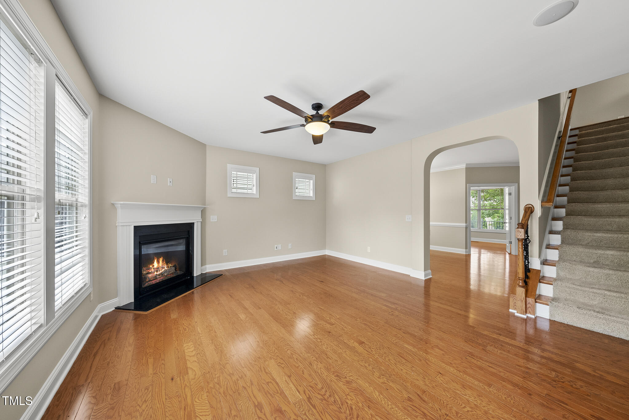 5120 Audreystone Drive Cary, NC 27518 - Photo 26 of 65 a view of an empty room with wooden floor and a window