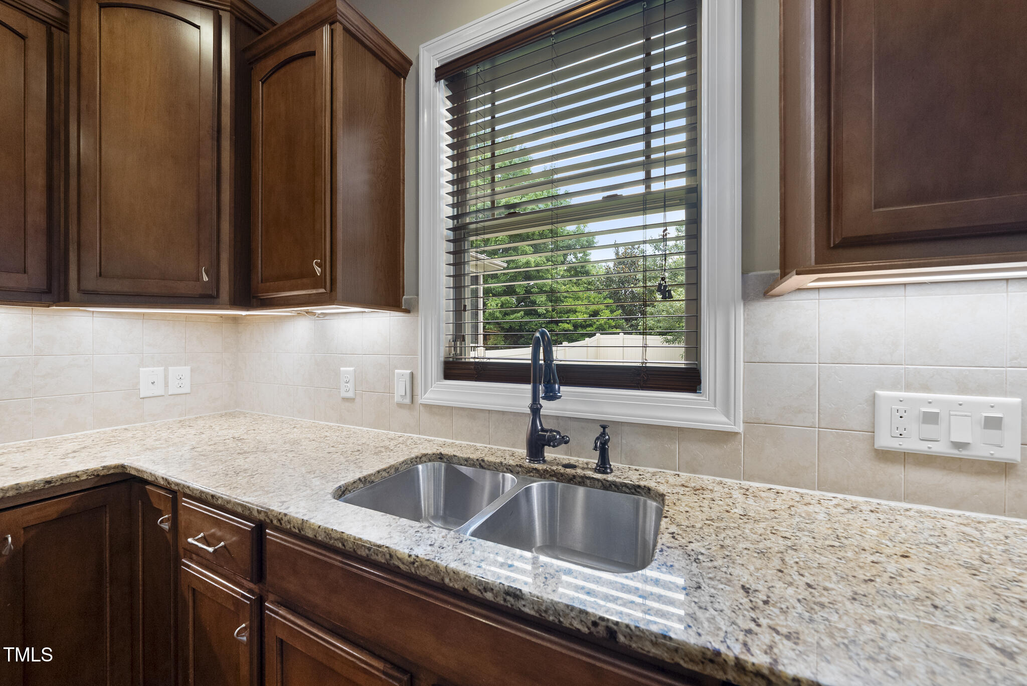 5120 Audreystone Drive Cary, NC 27518 - Photo 30 of 65 a kitchen with granite countertop a sink and a granite counter tops