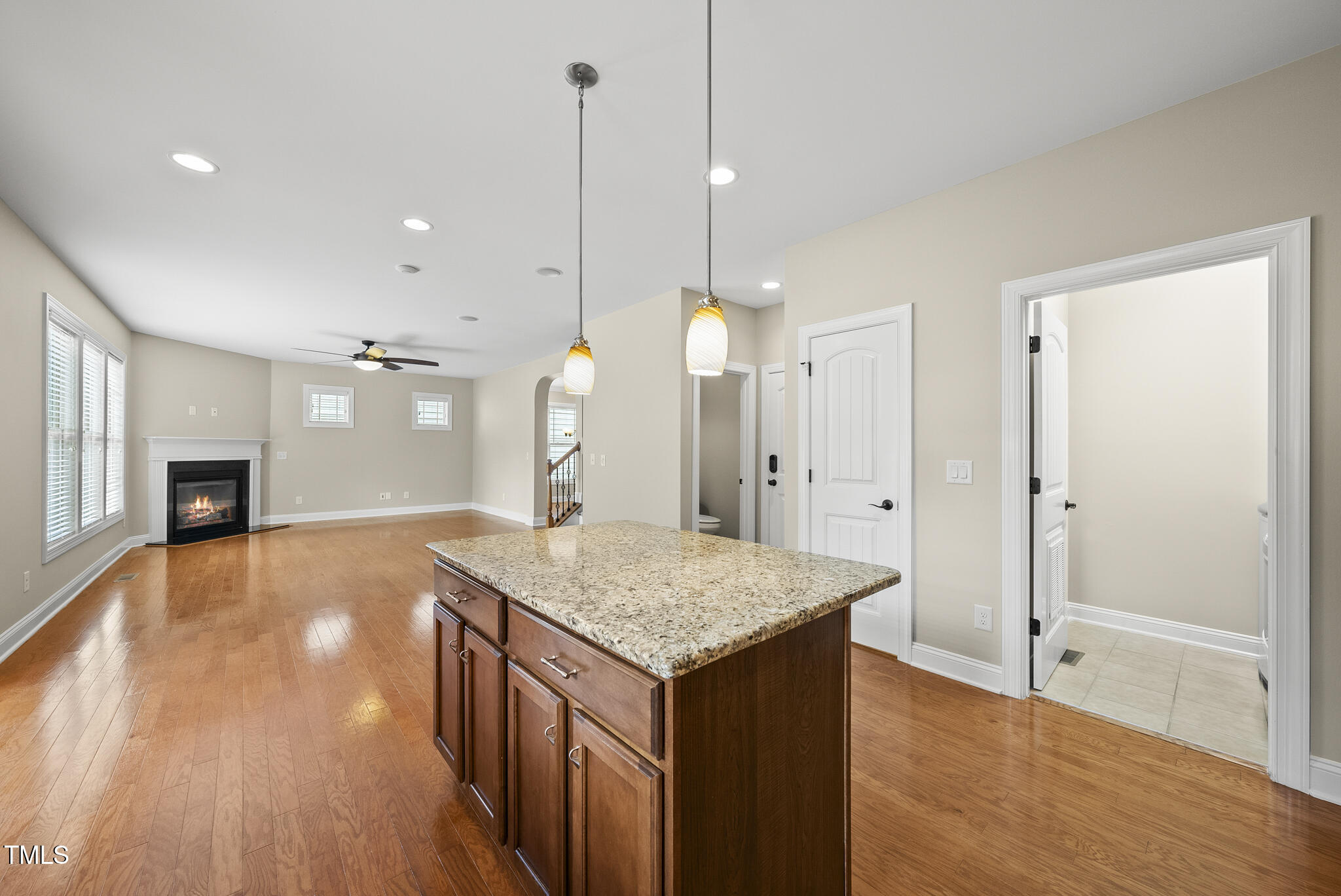 5120 Audreystone Drive Cary, NC 27518 - Photo 65 of 65 a kitchen with a sink chandelier and wooden floor