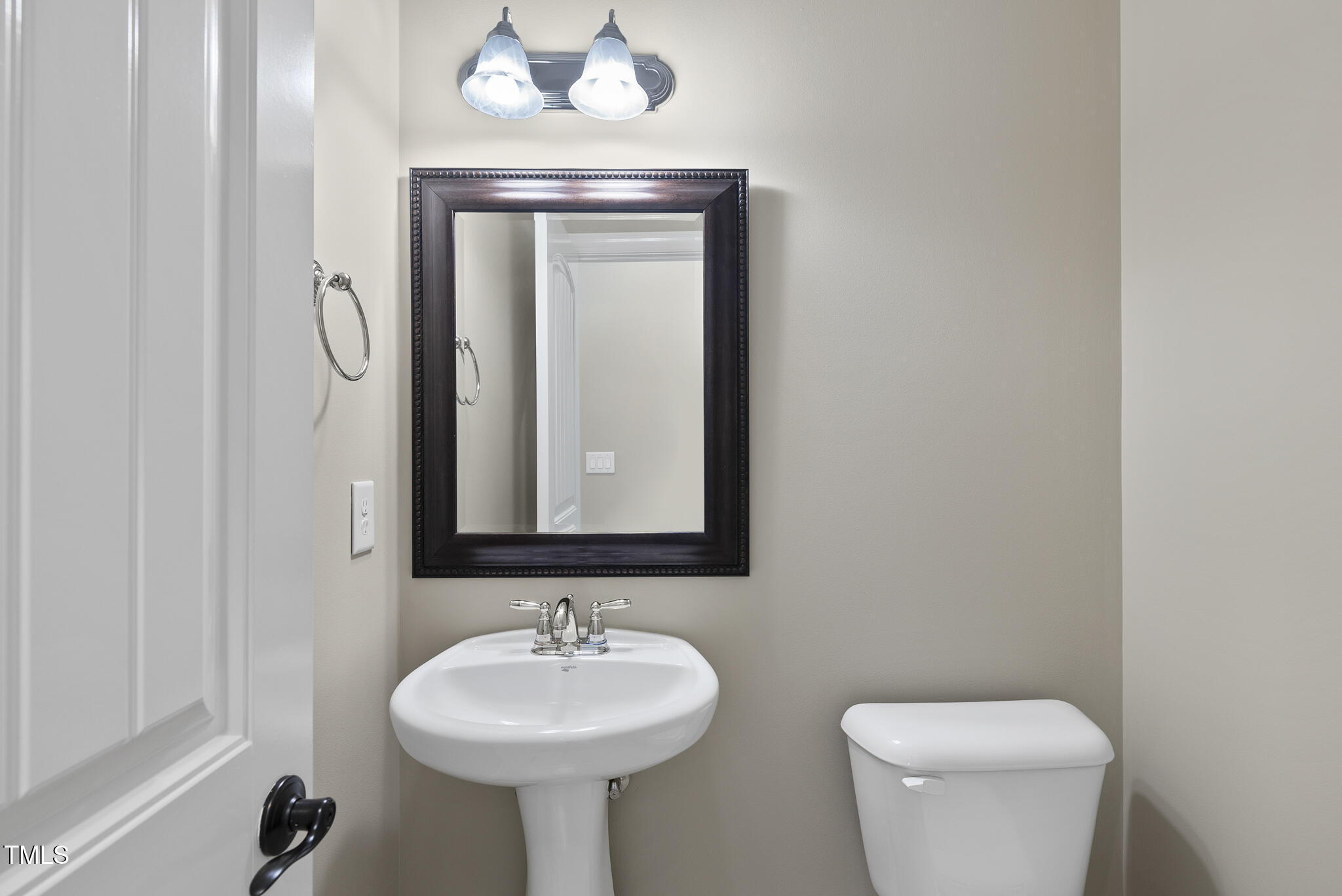 5120 Audreystone Drive Cary, NC 27518 - Photo 32 of 65 a bathroom with a toilet sink and mirror