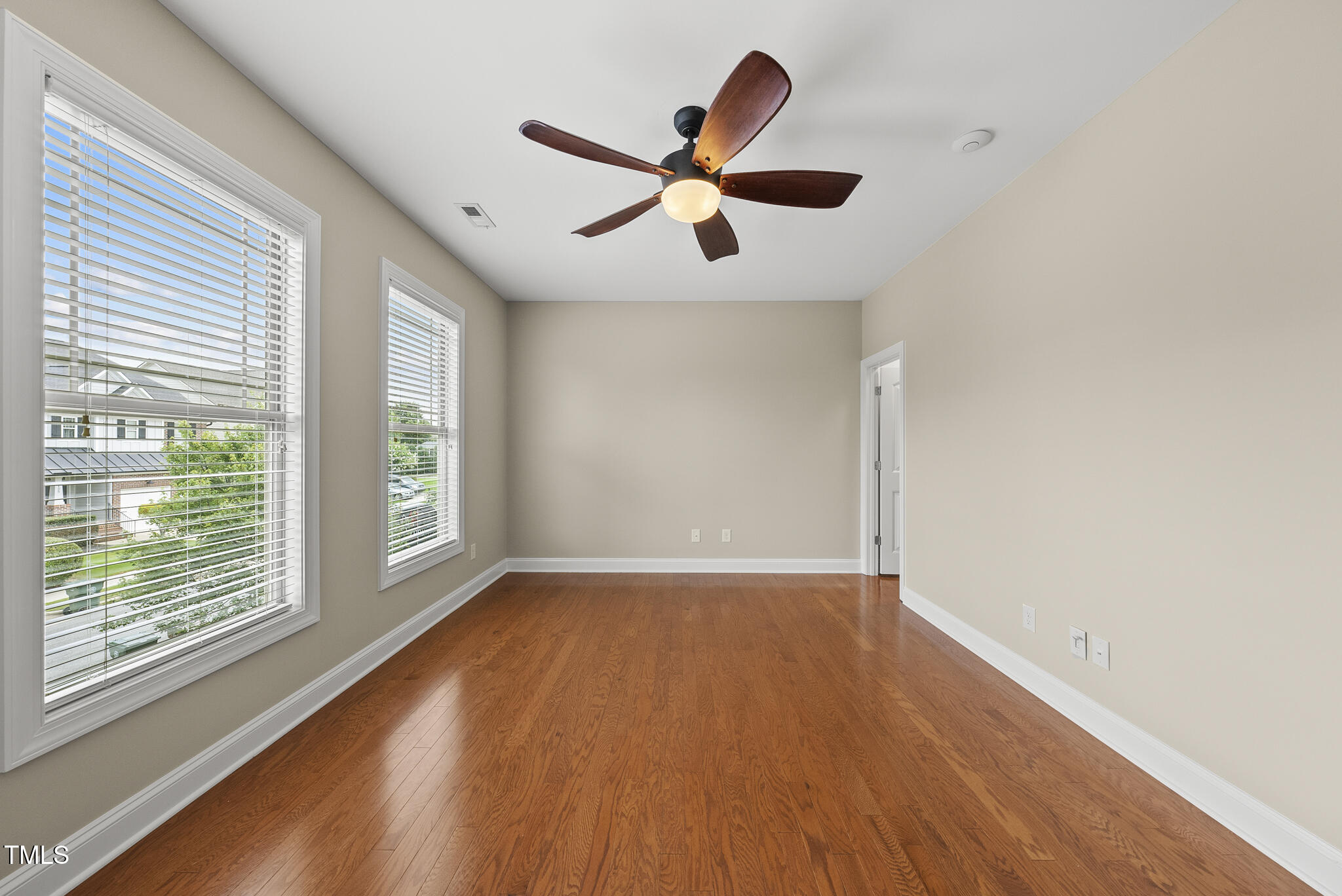 5120 Audreystone Drive Cary, NC 27518 - Photo 39 of 65 a view of empty room with wooden floor and fan