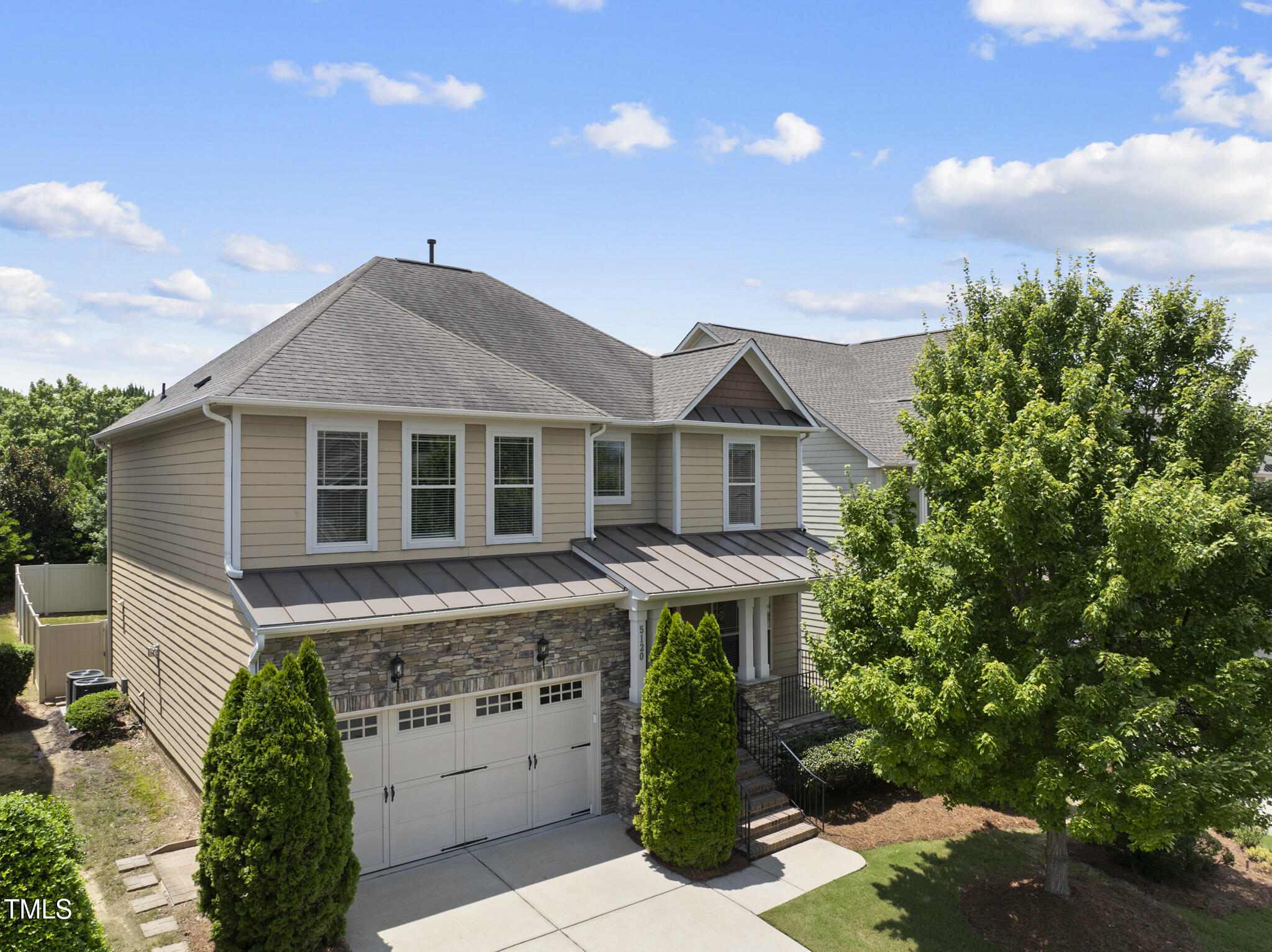 5120 Audreystone Drive Cary, NC 27518 - Photo 52 of 65 a front view of house with a garden