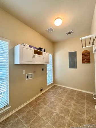 a view of a storage & utility room with a window