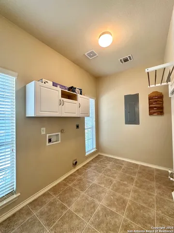 a view of a storage & utility room with a window