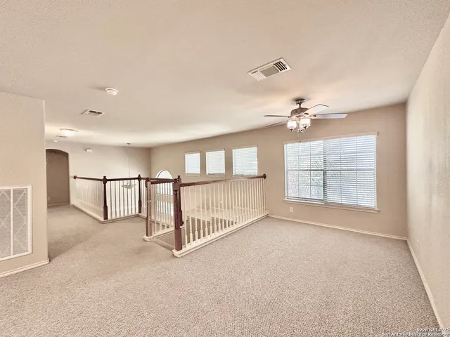 a view of entryway and hall with a chandelier