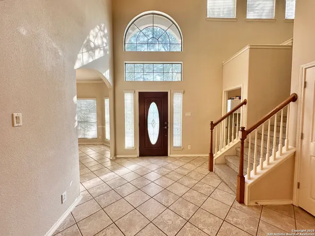 a view of livingroom with furniture and front door