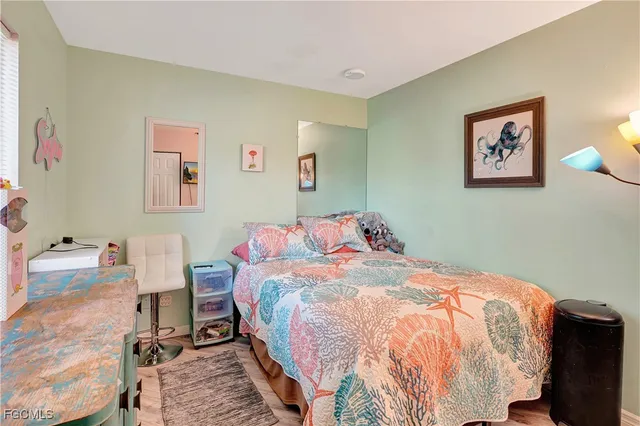 a bedroom with a bed and a table in it