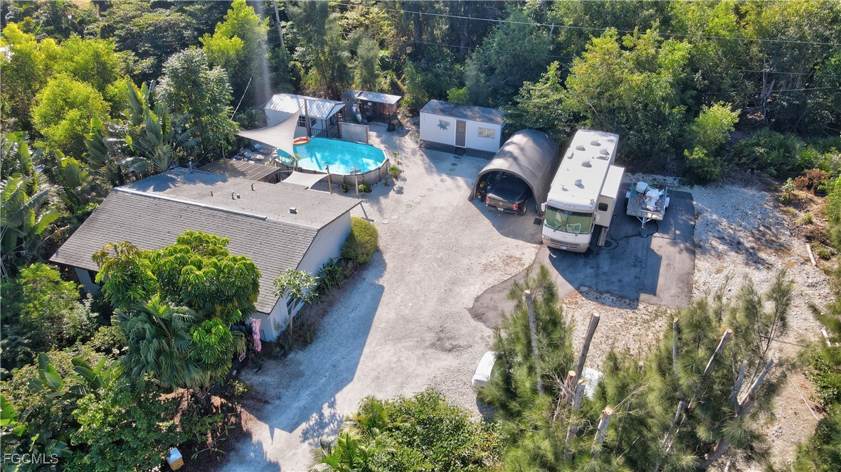 5887 Kingfish Road Bokeelia, FL 33922 - Photo 32 of 34 an aerial view of a house with outdoor space