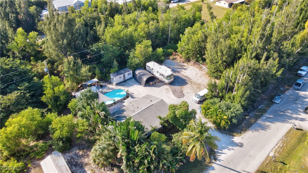 5887 Kingfish Road Bokeelia, FL 33922 - Photo 33 of 34 view of backyard with swimming pool
