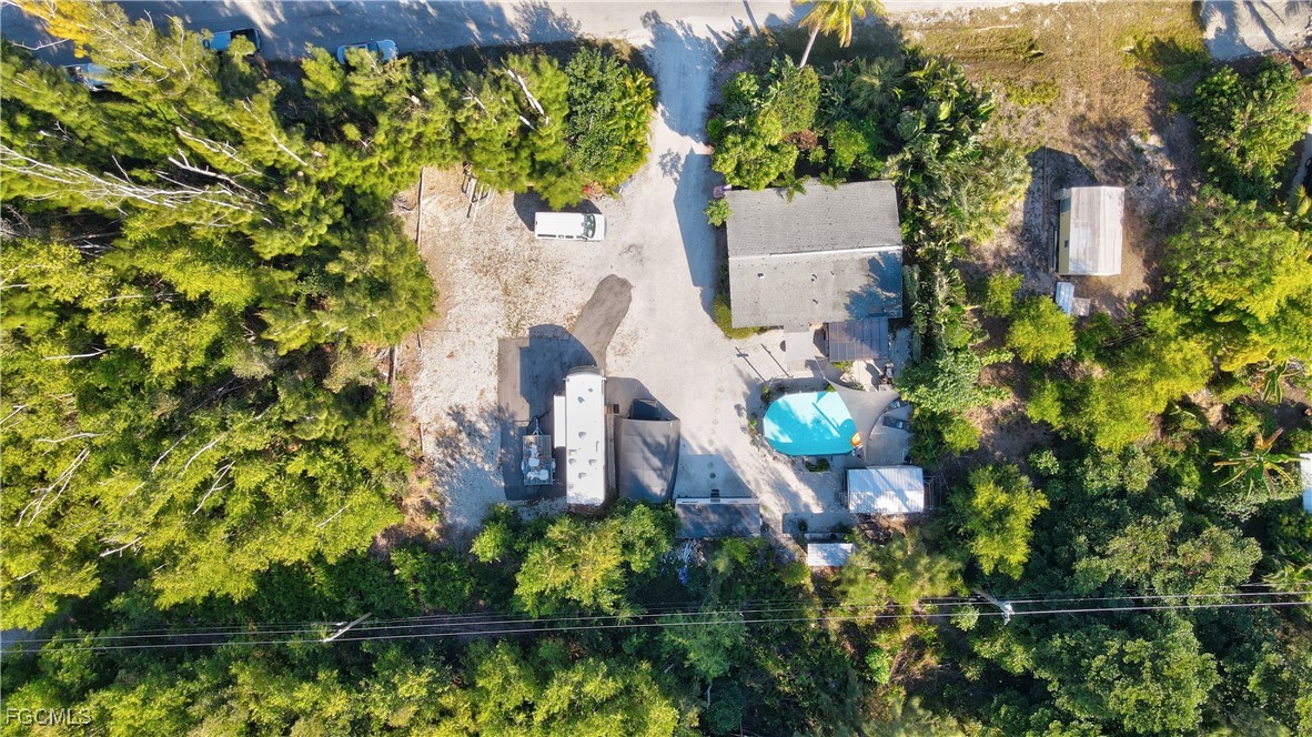 5887 Kingfish Road Bokeelia, FL 33922 - Photo 34 of 34 view of a house with a yard and garden