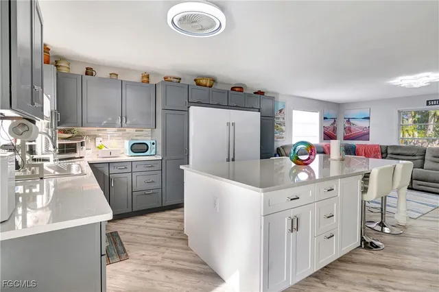 a kitchen that has a cabinets and a table in it