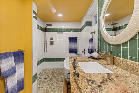 a bathroom with a sink and a mirror