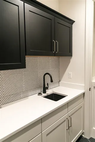 a close view of a sink and a microwave