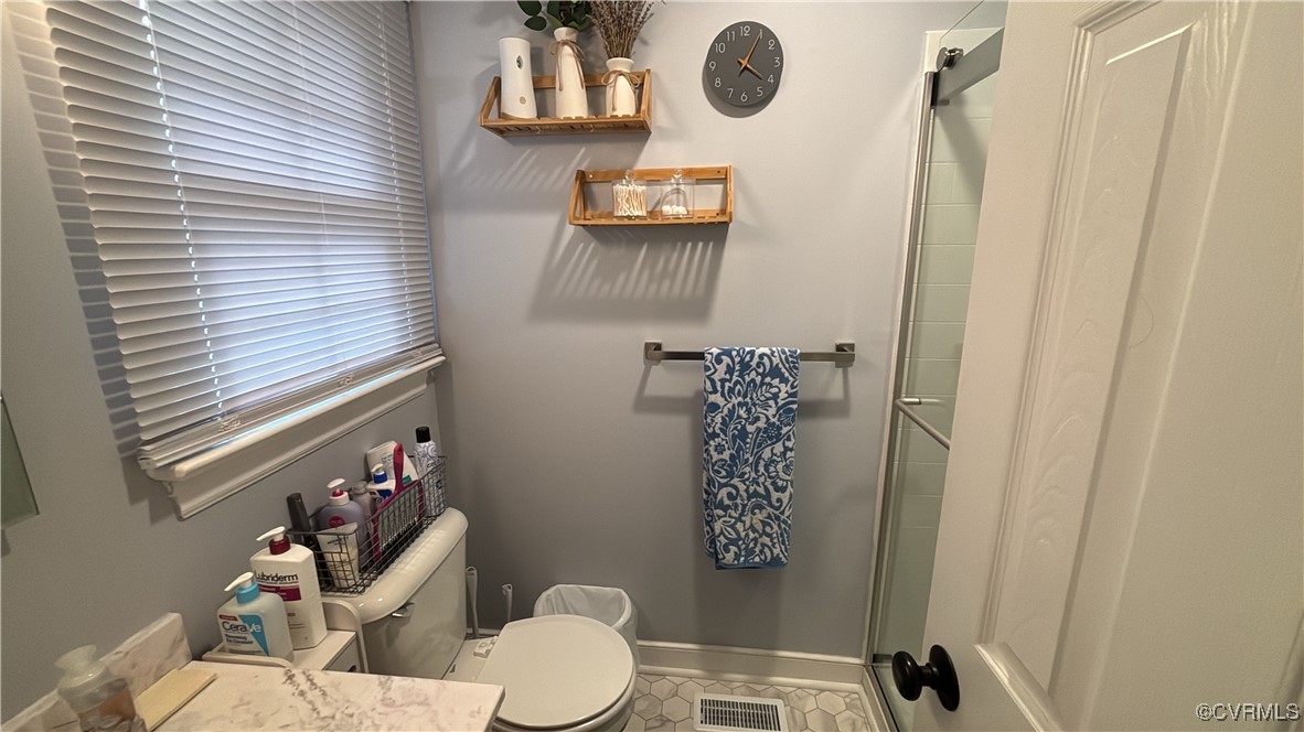 2683 Beulah Church Road St. Stephens Church, VA 23148 - Photo 19 of 23 Bathroom with visible vents, a stall shower, toile