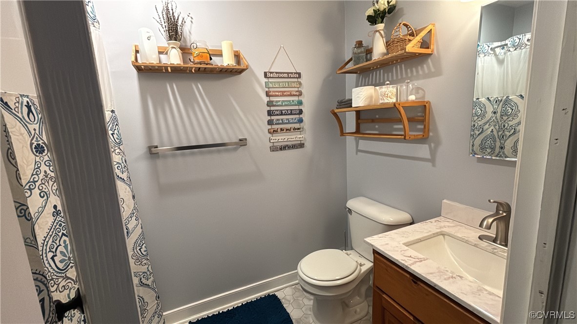 2683 Beulah Church Road St. Stephens Church, VA 23148 - Photo 22 of 23 Bathroom with toilet, vanity, and baseboards