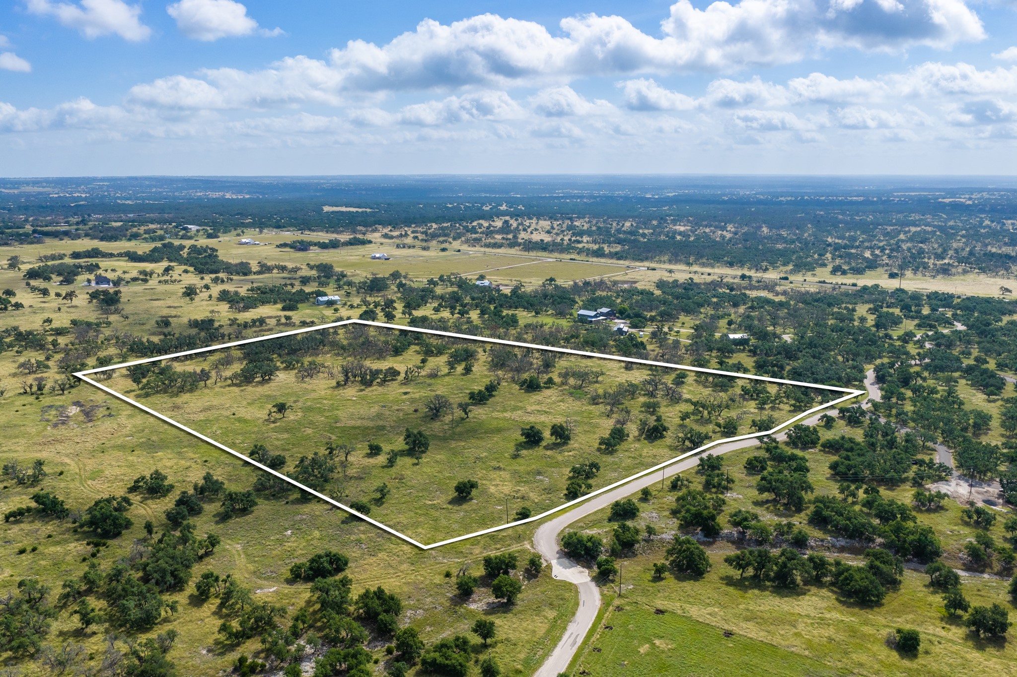 436 Stevens Ranch Road Harper, TX 78631 - Photo 3 of 31 Vast acreage outlined in white offers rolling terrain dotted with mature native trees.