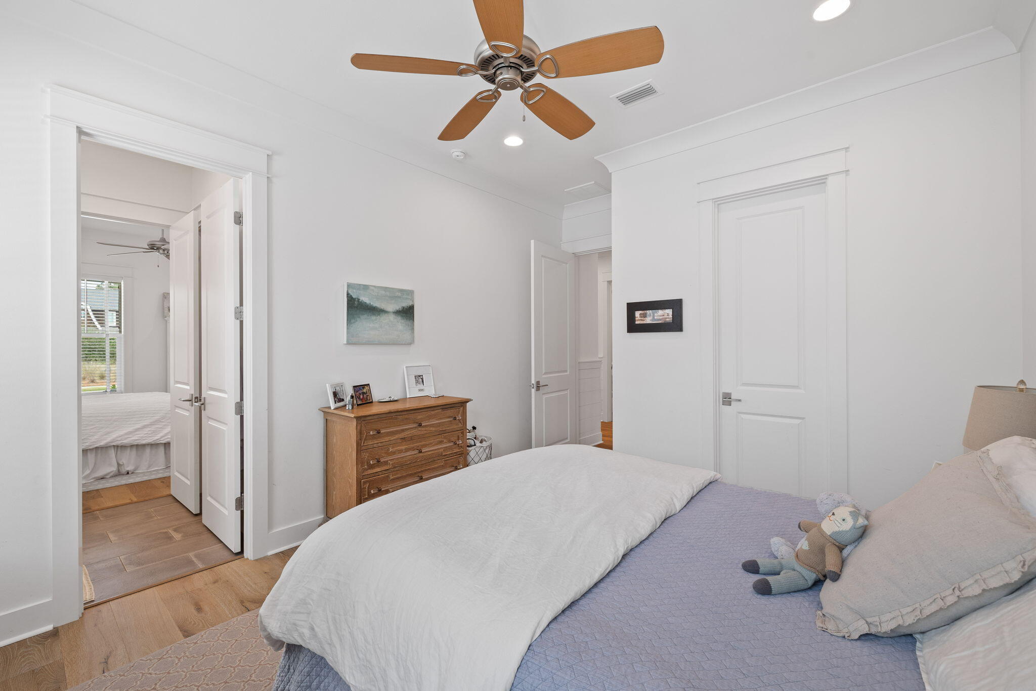 158 Trailhead Drive Inlet Beach, FL 32461 - Photo 27 of 35 a bedroom with a bed and a chandelier