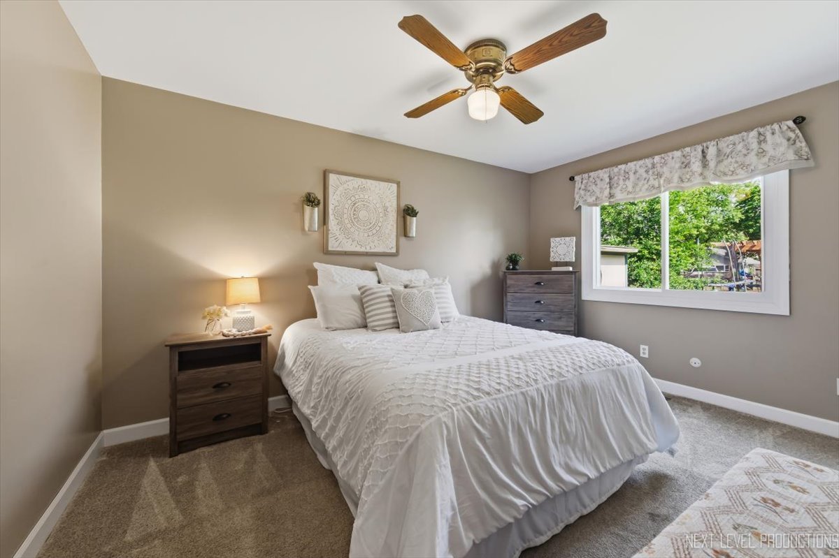 10 Shermead Road Montgomery, IL 60538 - Photo 13 of 30 a bedroom with a bed and a large window