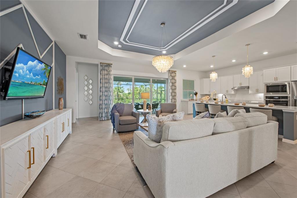 7161 Inlet Isles Lakewood Ranch, FL 34202 - Photo 4 of 29 a living room with furniture and a flat screen tv