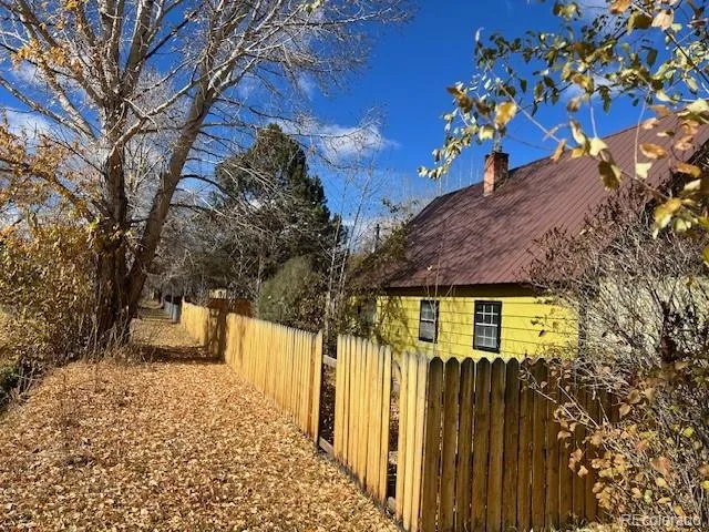 a view of a house with a tree