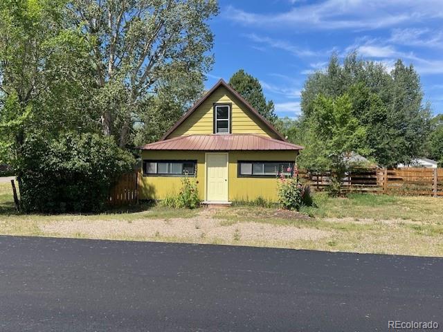 355 9th Street Saguache, CO 81149 - Photo 2 of 42 a front view of a house with a yard