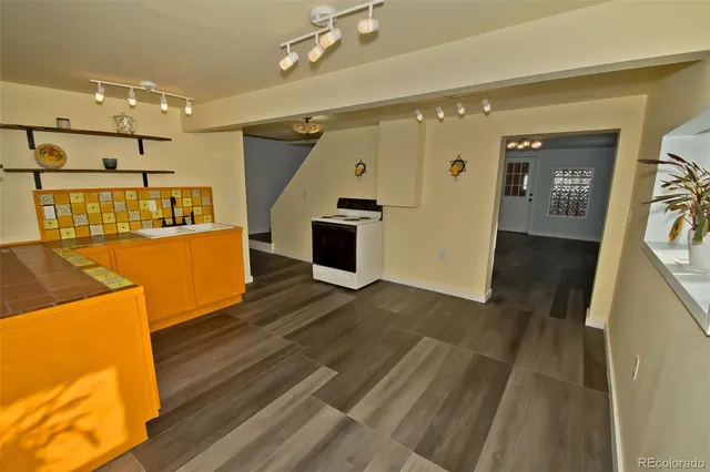 a view of a living room with wooden floor