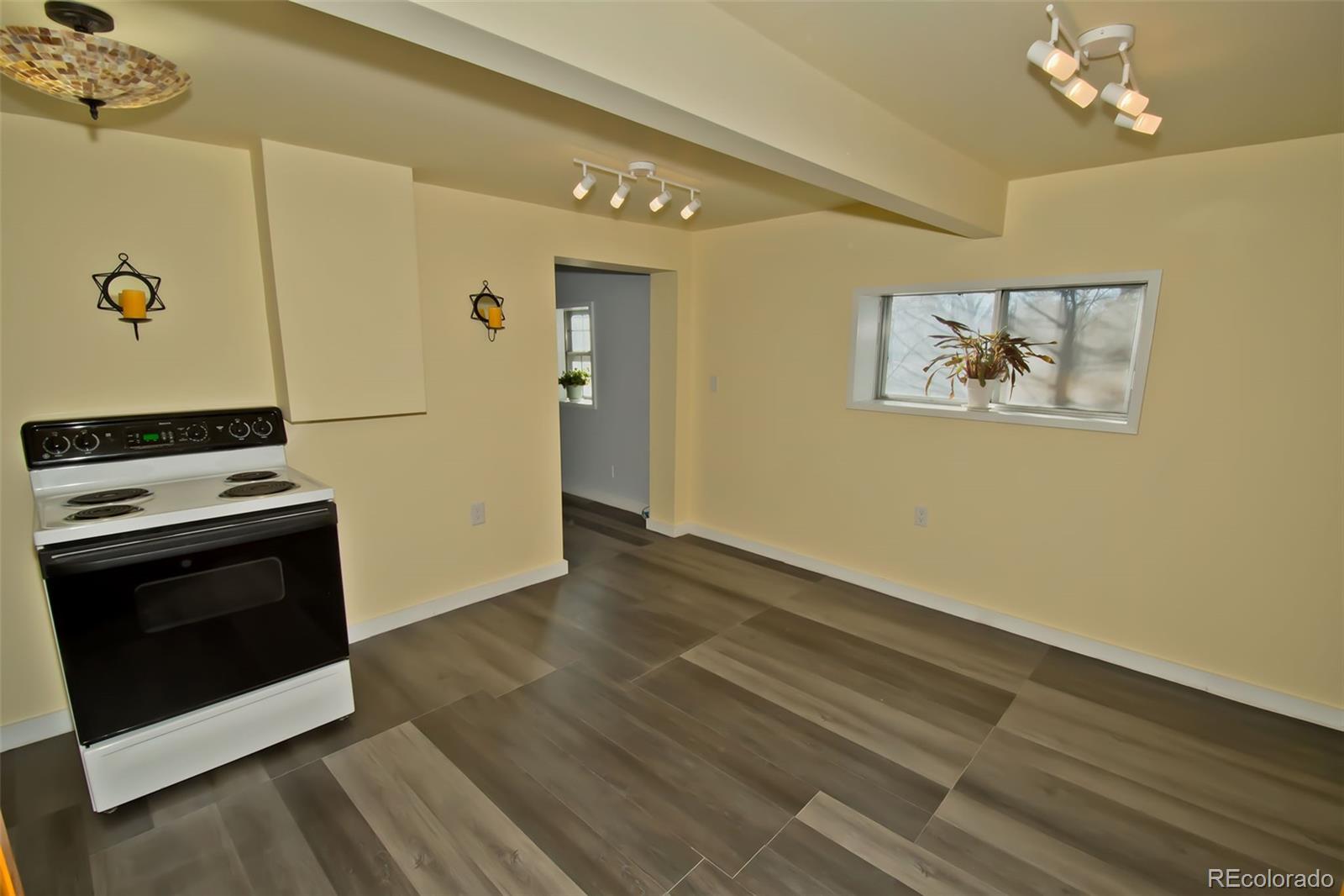 355 9th Street Saguache, CO 81149 - Photo 26 of 42 a view of kitchen with stainless steel appliances cabinets and wooden floor