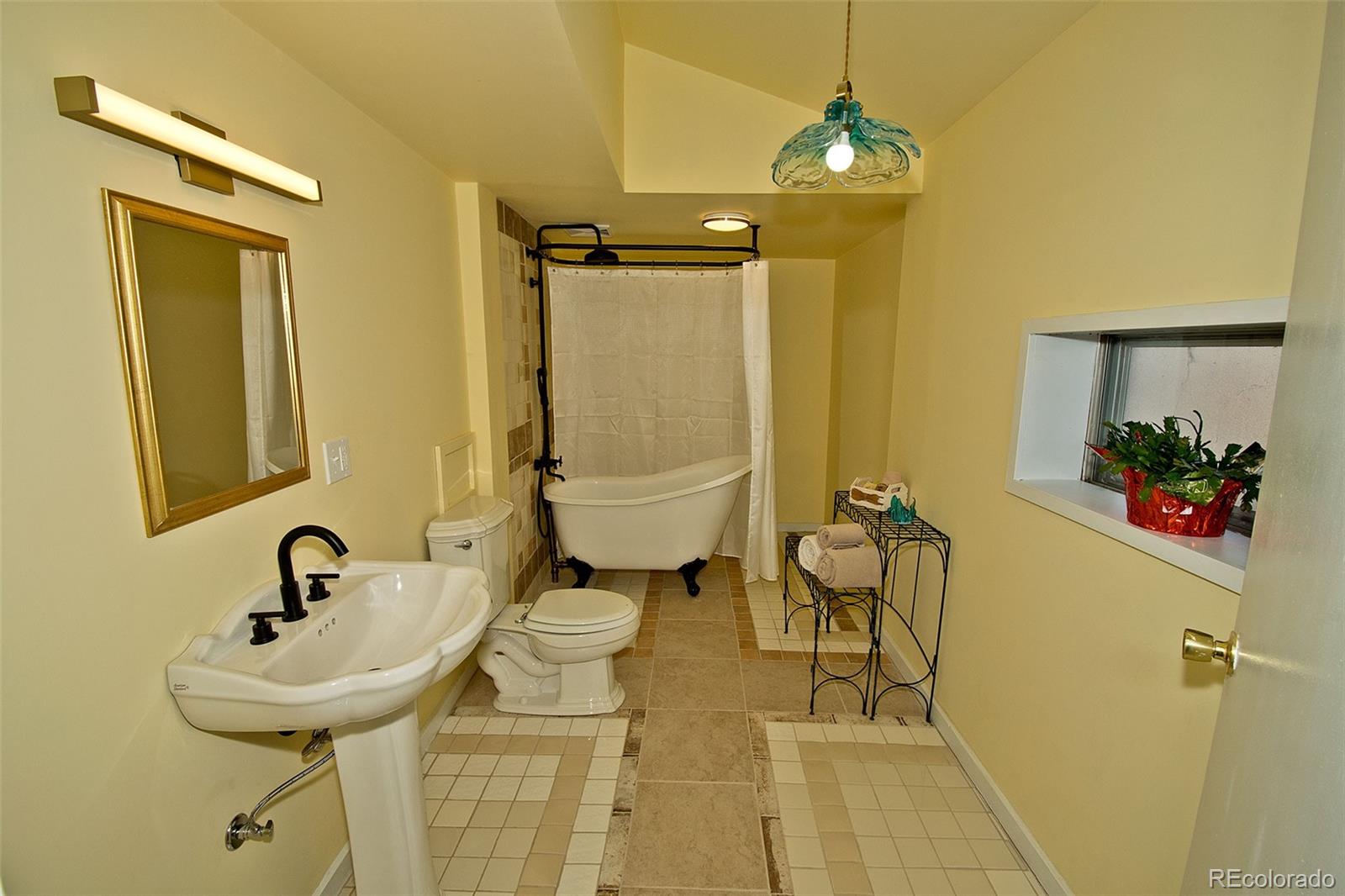 355 9th Street Saguache, CO 81149 - Photo 27 of 42 a bathroom with a sink and a mirror