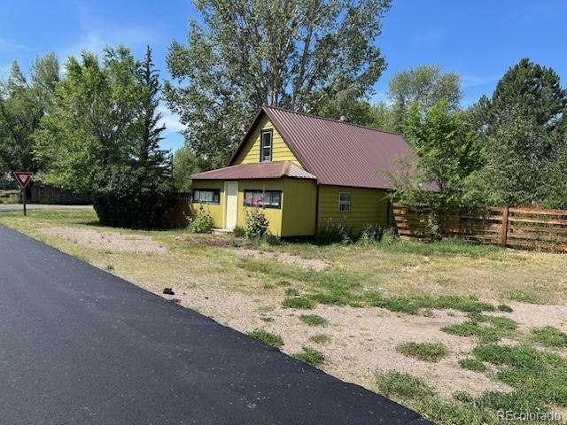 355 9th Street Saguache, CO 81149 - Photo 3 of 42 a house with trees in the background