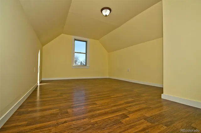 a view of a livingroom with wooden floor