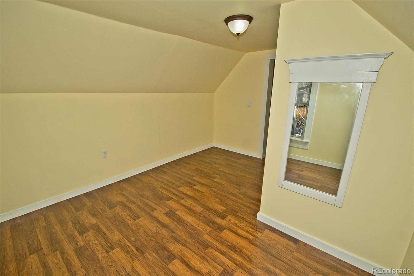 355 9th Street Saguache, CO 81149 - Photo 36 of 42 a view of a room with wooden floor and a hallway