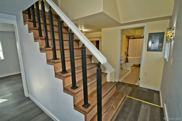 a stove top oven sitting inside of a kitchen