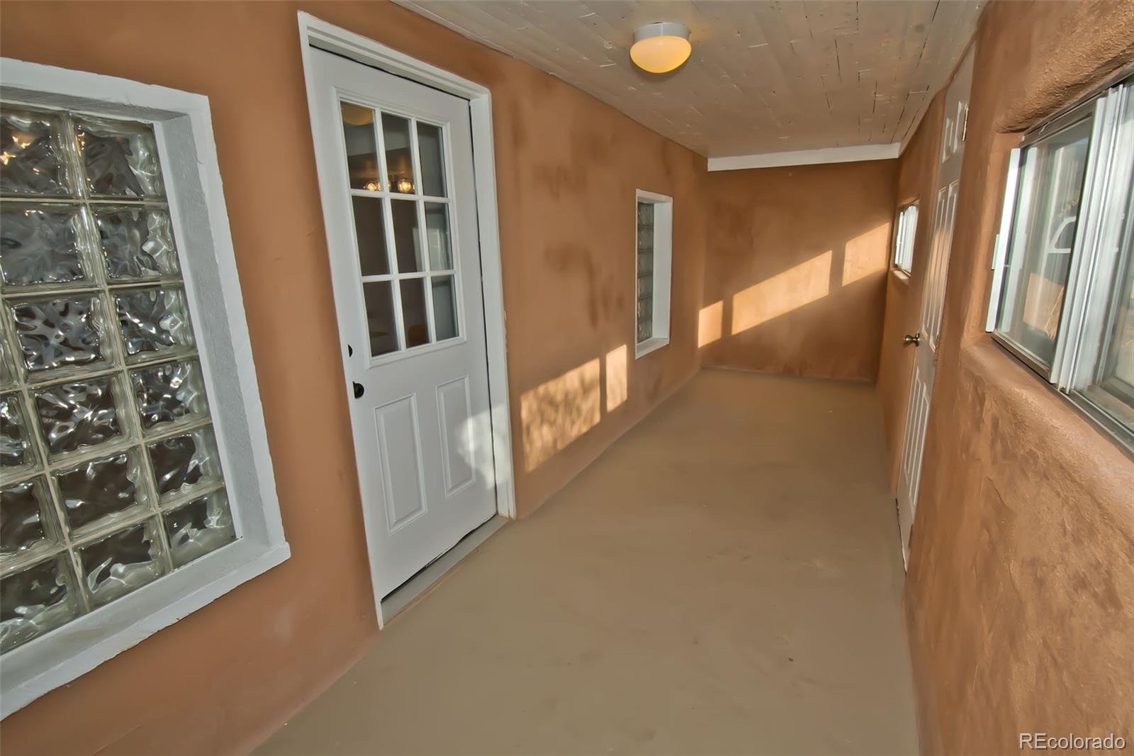 355 9th Street Saguache, CO 81149 - Photo 40 of 42 a view of a hallway with windows