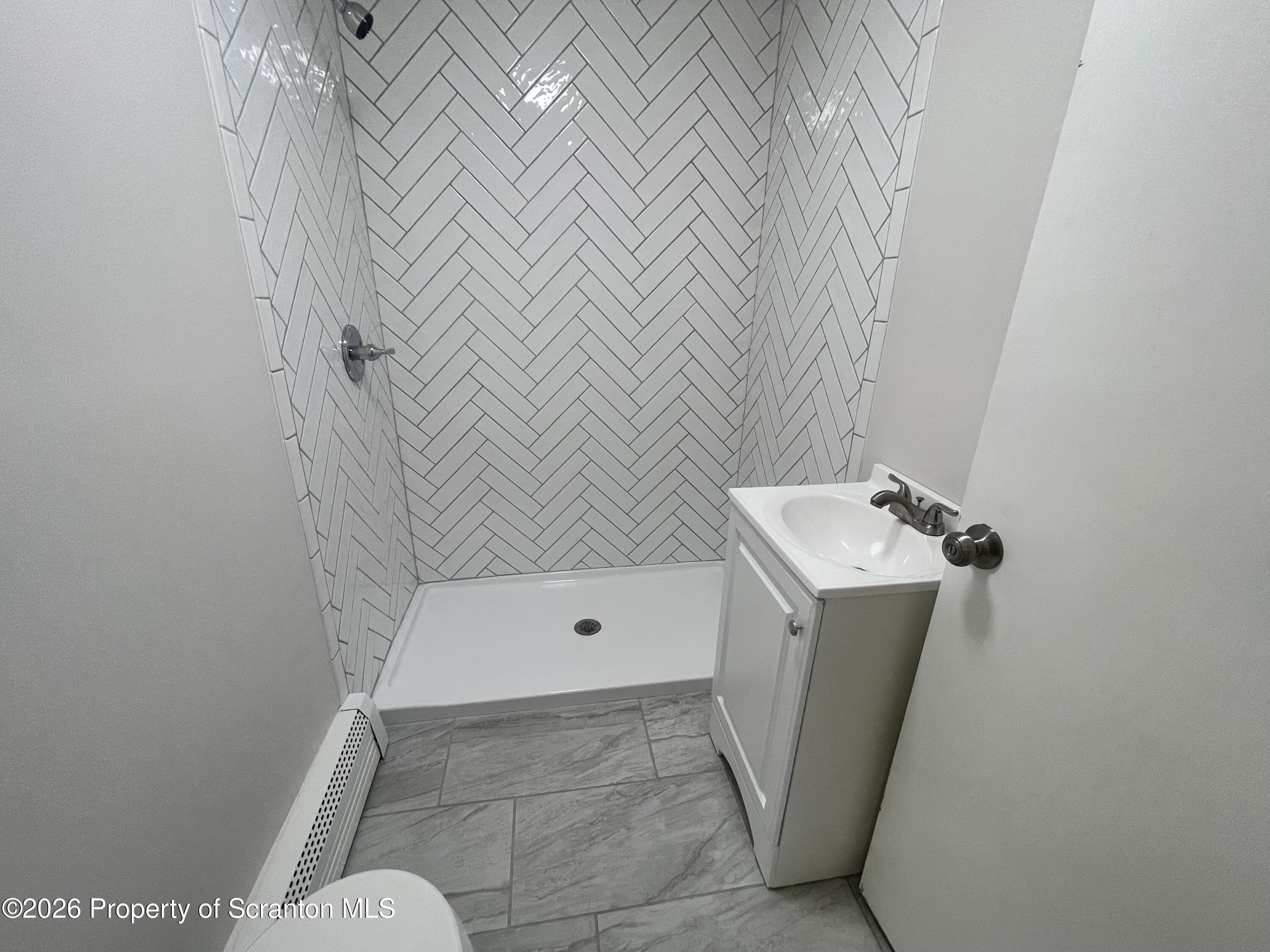 238 George Street Moosic, PA 18507 - Photo 8 of 23 a bathroom with a sink and toilet