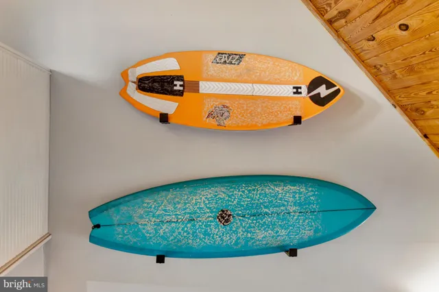 a bedroom with a bed and flat screen tv