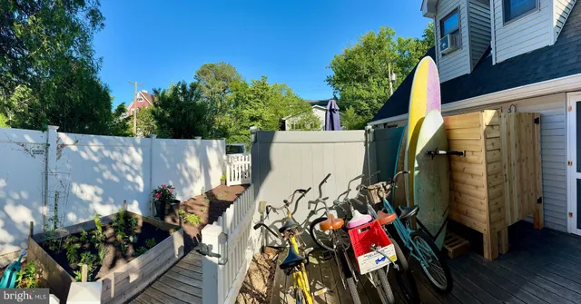 a living room with fireplace furniture and a flat screen tv