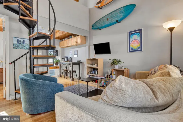 an aerial view of a house with a backyard