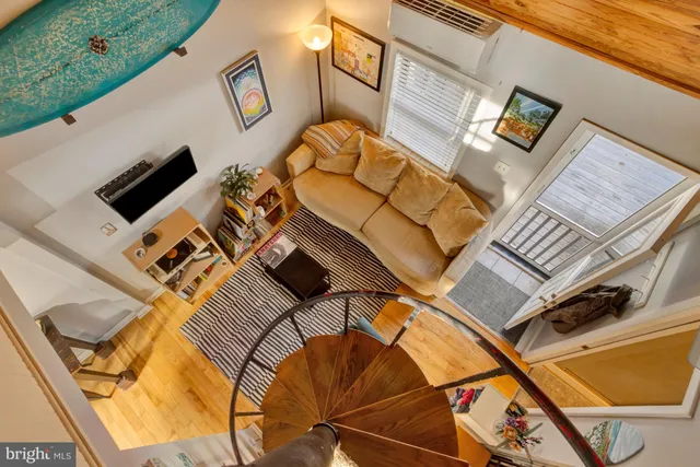 a livingroom with furniture window and wooden floor
