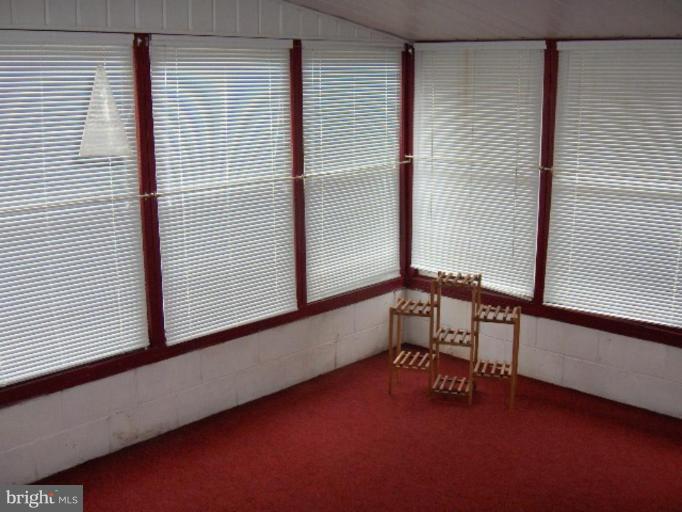 7922 Shore Road Sparrows Point, MD 21219 - Photo 5 of 8 a view of an empty room with a window