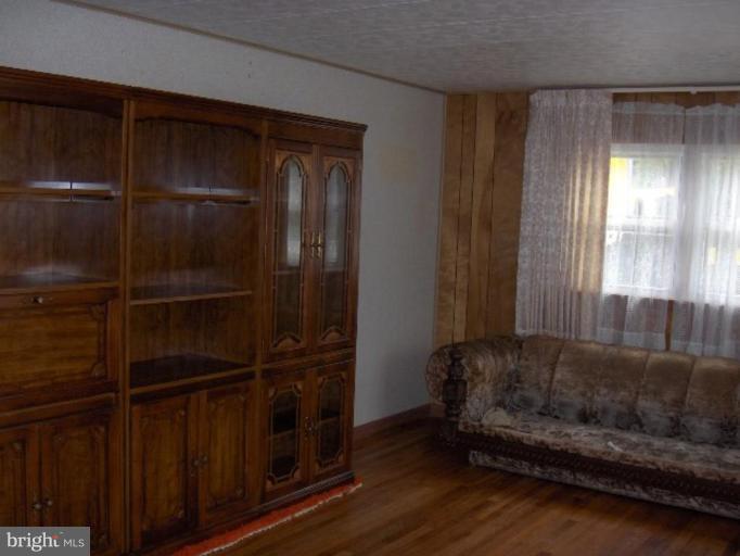 7922 Shore Road Sparrows Point, MD 21219 - Photo 6 of 8 a living room with furniture and a window