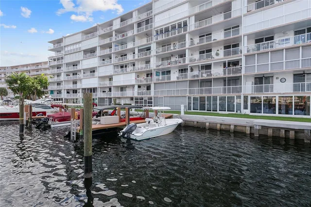 a roof deck with table and chairs