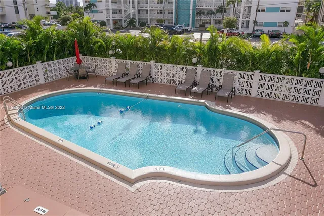 a view of a swimming pool with a patio