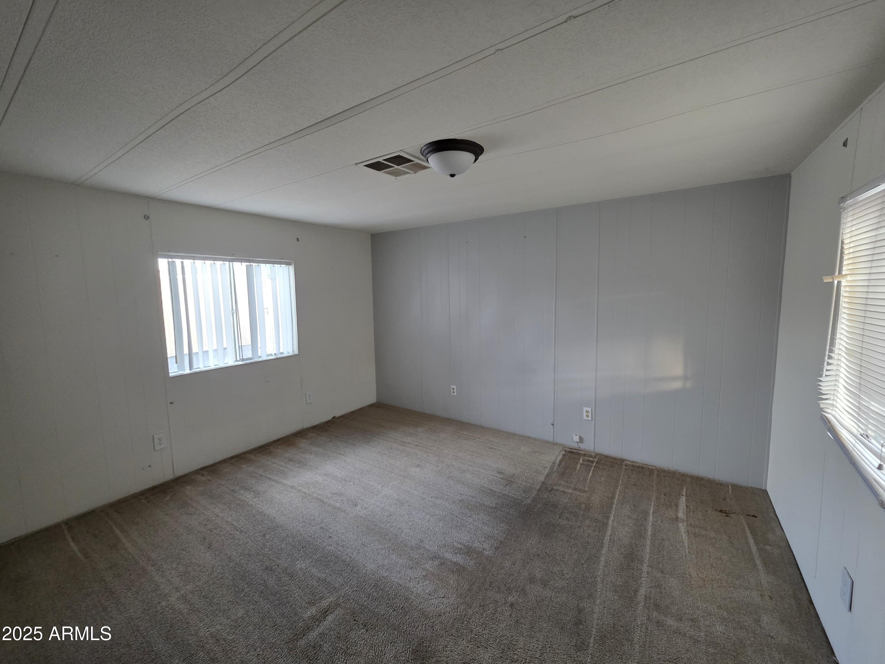 4800 West Ocotillo Road, Unit 105 Glendale, AZ 85301 - Photo 11 of 20 an empty room with windows